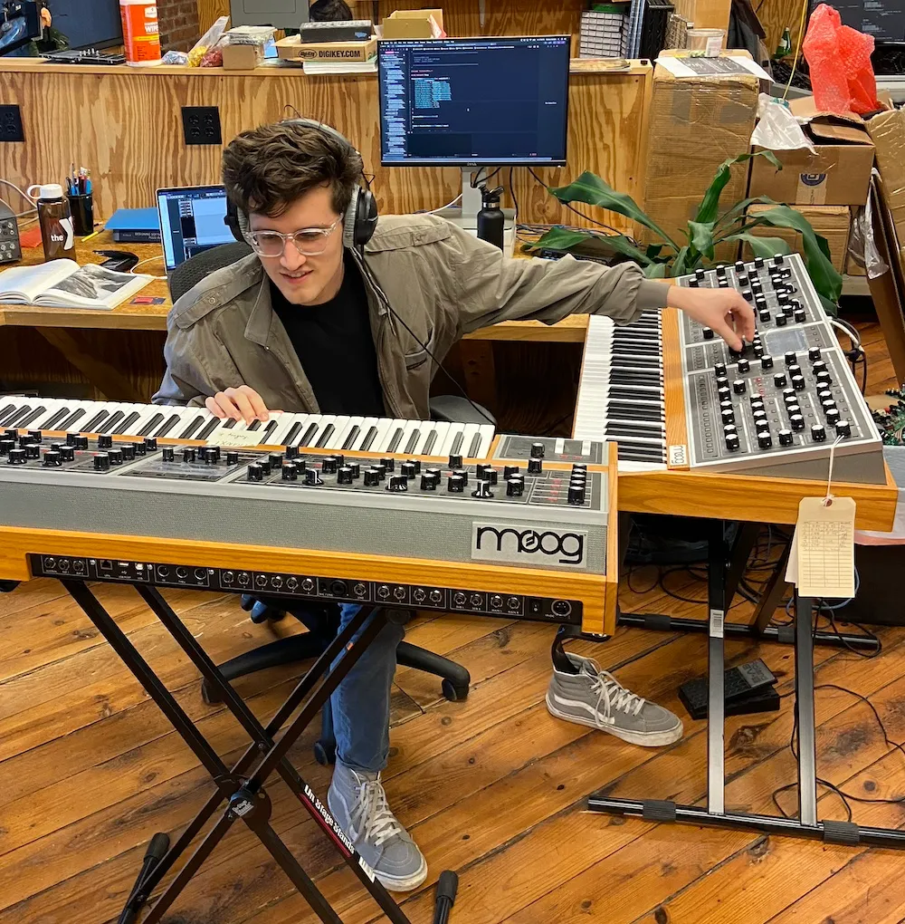 Connor Golden playing a Moog One synthesizer in the ResGuide studio
